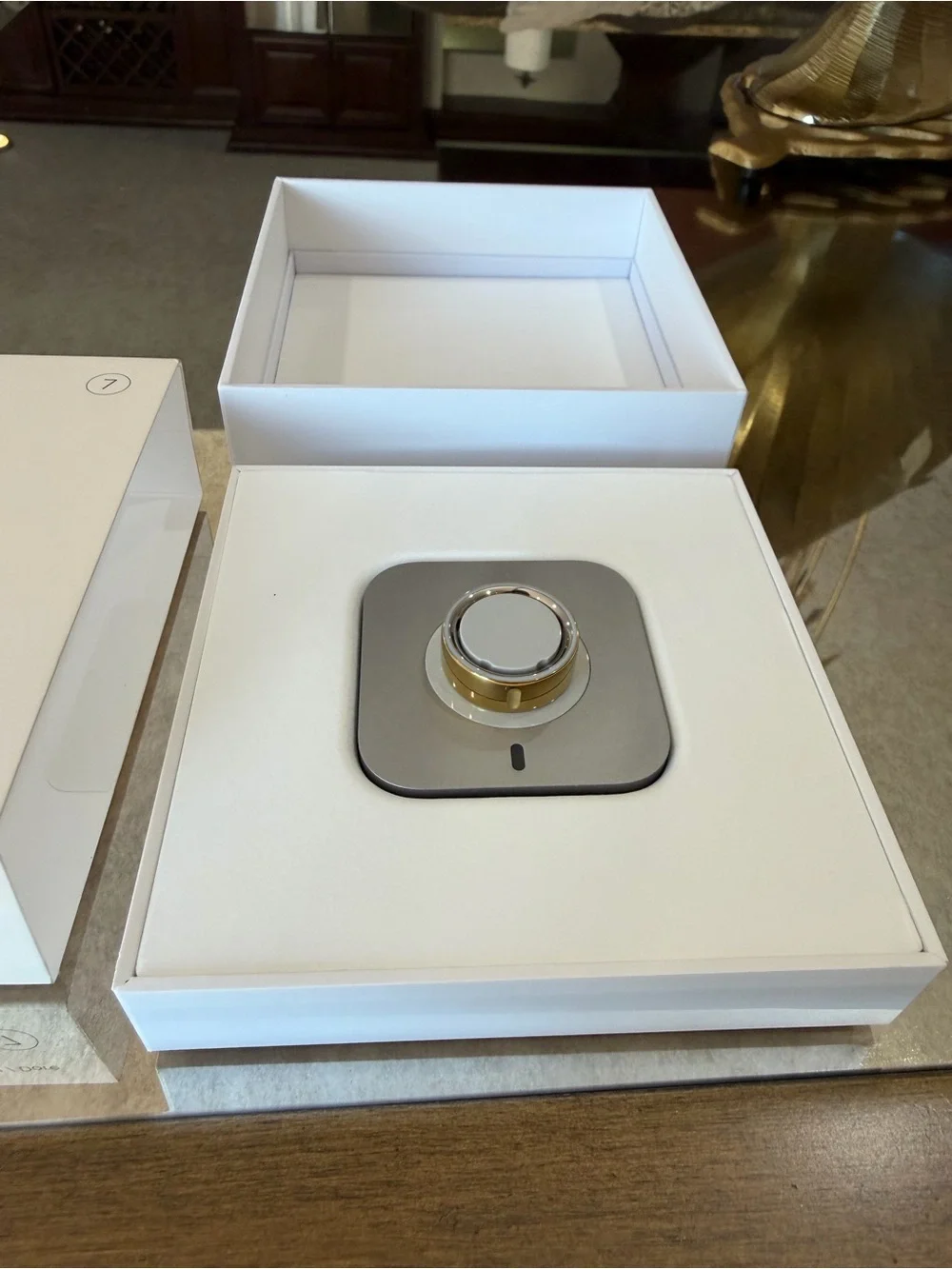 Oura Box with Gold Accents and White Packaging